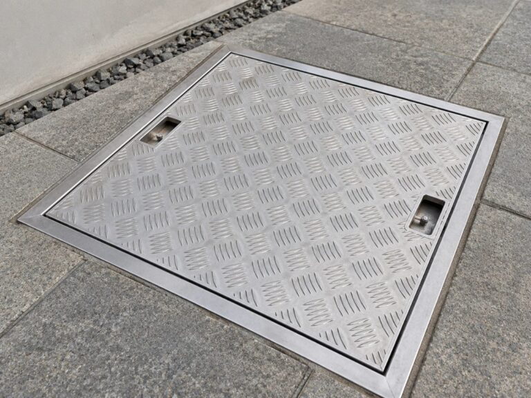 Aluminium chequer cover in paving