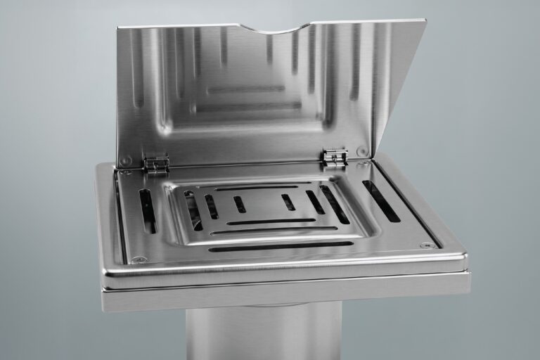 Stainless steel floor drain with hinged cover