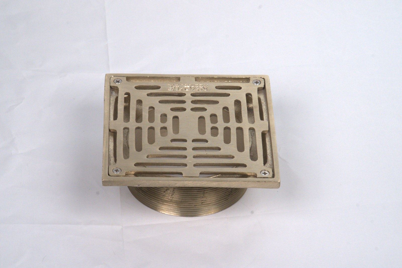 Nickel bronze drain top in a finished floor