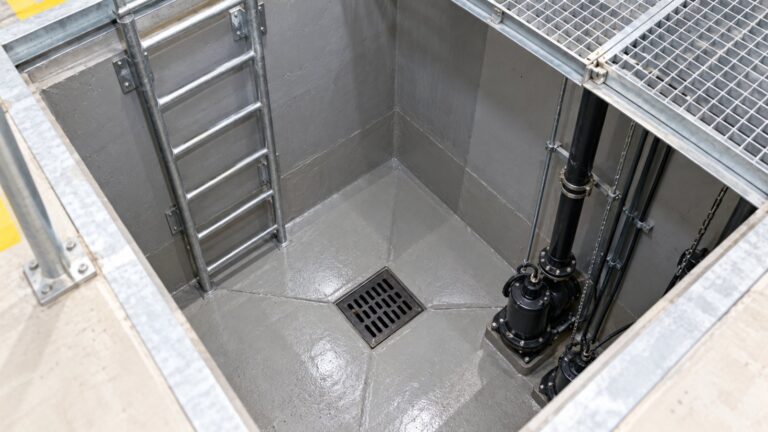 Cast iron pit drain at the bottom of a basement pump sump in a Dubai building